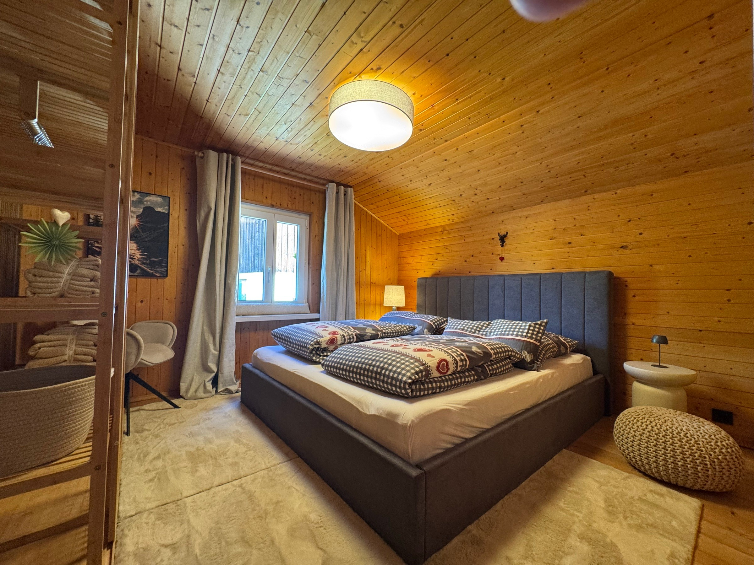 Bedroom 2 with upholstered double bed and checked bedding